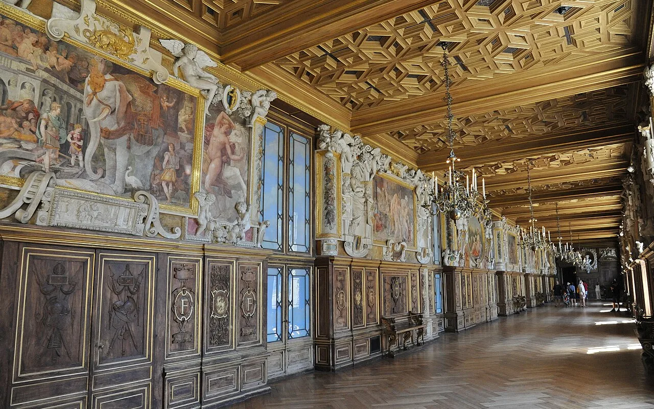 Frescoes and stucco framing along the gallery walls