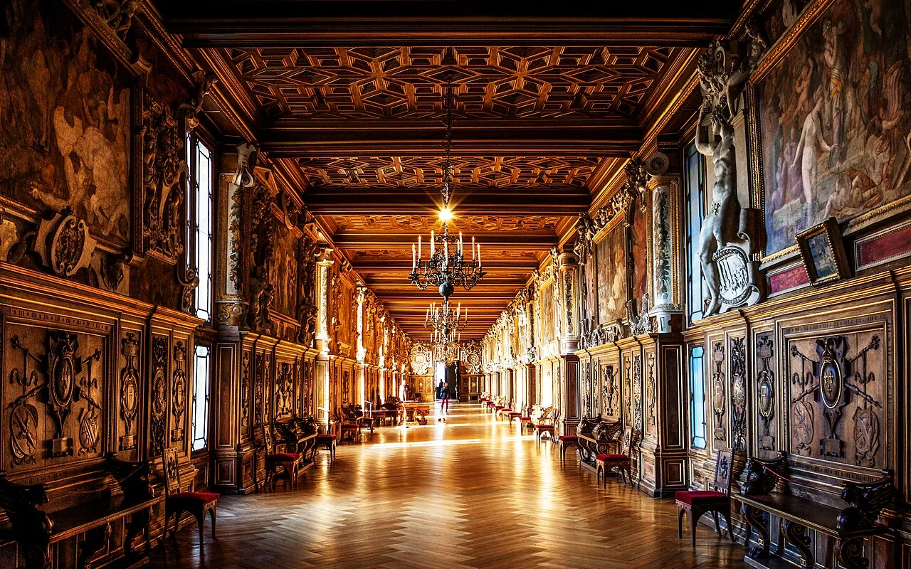 The Gallery of François I, panelled and frescoed, receding into the distance